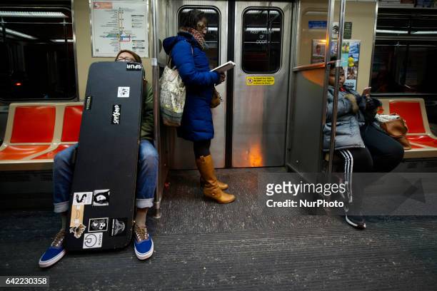 Commuters are seen onboard of a SouthEastern Pennsylvania Transportation Authority Broad Street Line subway, in Philadelphia, PA, on February 16th,...
