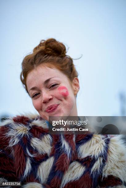 portrait of a woman with a lipstick kiss on her cheek - red lipstick kiss stock pictures, royalty-free photos & images