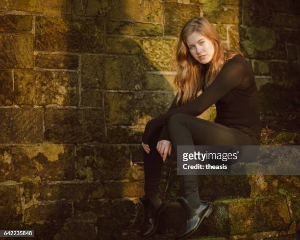 beautiful young woman in black - theasis stock pictures, royalty-free photos & images