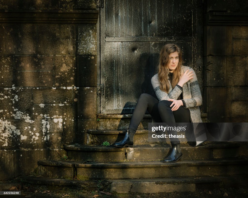 Beautiful young woman in black and grey