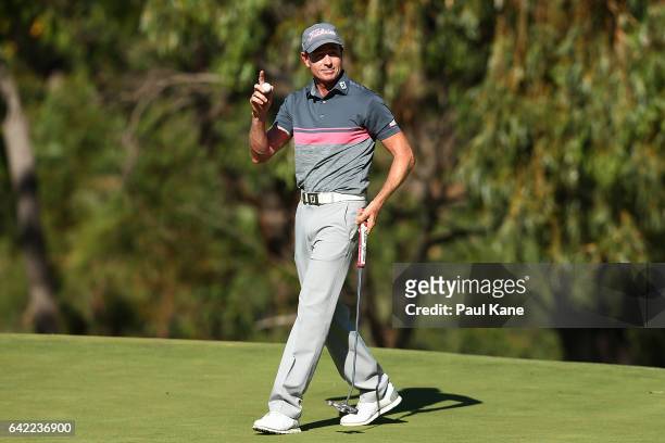 Brett Rumford of Australia acknowledges the gallery on the 18th green after completing his round during round two of the ISPS HANDA World Super 6...