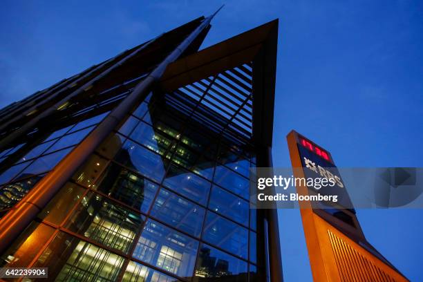 Pillar with a logo, displaying the time, stands outside the Royal Bank of Scotland Group Plc headquarters in London, U.K., on Wednesday, Feb. 15,...