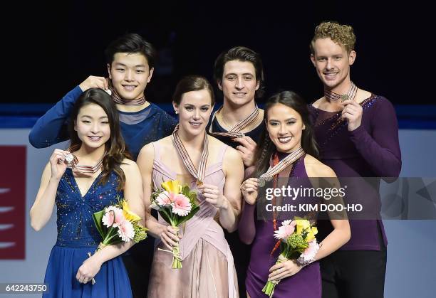 Winners Tessa Virtue and Scott Moir of Canada pose with second-placed Maia Shibutani and Alex Shibutani of the US and third-placed Madison Chock and...