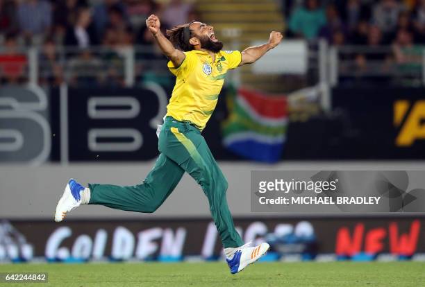 Imran Tahir of South Africa celebrates after taking the wicket of Luke Ronchi of New Zealand during the Twenty20 international cricket match between...
