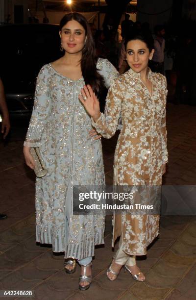 Bollywood actors Kareena Kapoor and Karisma Kapoor during the 70th birthday celebration of veteran actor Randhir Kapoor, at his bungalow, Chembur, on...