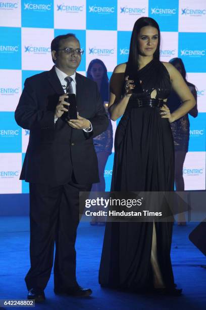 Manish Aggarwal, CEO, Centric Mobile, and Bollywood actor Neha Dhupia during the launch of Centric Smartphones new range, at ITC Maratha, Andheri, on...