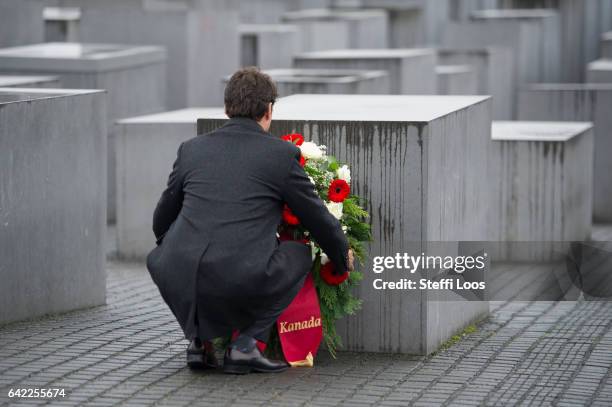 Canadian Prime Minister Justin Trudeau carries a wreath to a stellae at the Memorial to the Murdered Jews of Europe, also called the Holocaust...