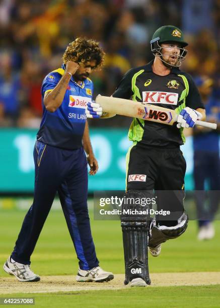 Lasith Malinga of Sri Lanka celebrates the wicket of Travis Head of Australia during the first International Twenty20 match between Australia and Sri...