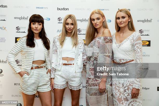 Giant Models wearing Matea Couture arrives at the Fashion Aid marquee at the Kennedy Twilight Beach Polo on February 17, 2017 in Melbourne, Australia.