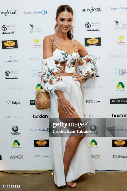 Emily Simms arrives at the Fashion Aid marquee at the Kennedy Twilight Beach Polo on February 17, 2017 in Melbourne, Australia.