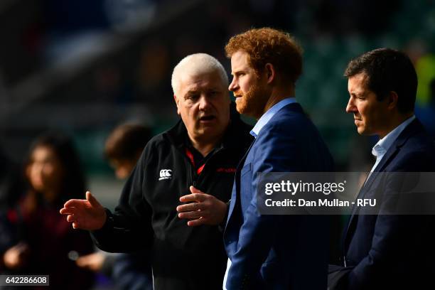 Prince Harry chats with head groundsman Keith Kent during an England open training session at Twickenham Stadium on February 17, 2017 in London,...