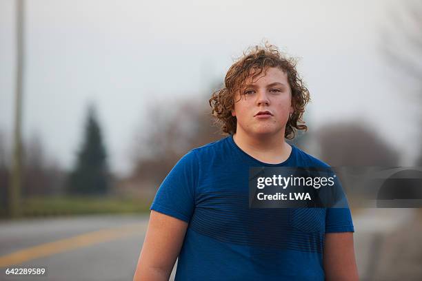 teen boy sweating after workout - boy portrait stock-fotos und bilder