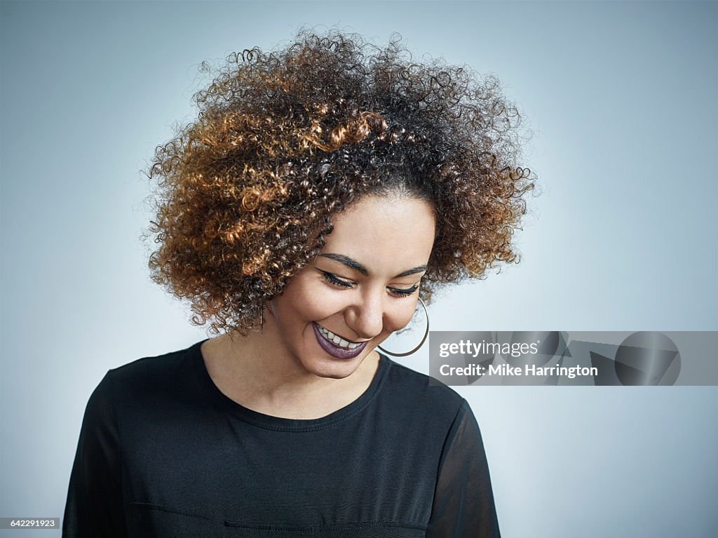 Close up portrait of black female looking down