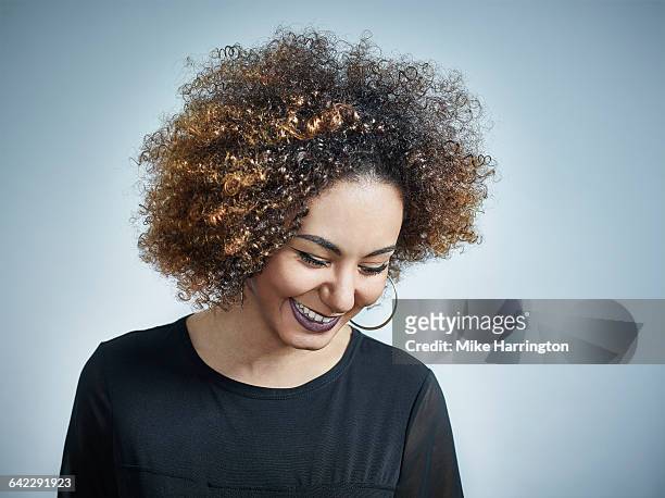 close up portrait of black female looking down - woman looking down smiling stock pictures, royalty-free photos & images