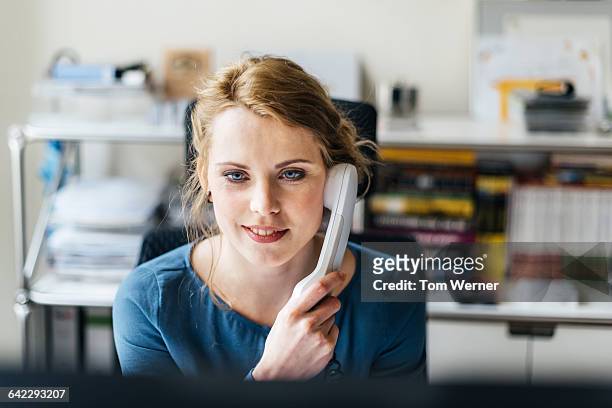 young casual businesswoman having a call - telefonlur bildbanksfoton och bilder
