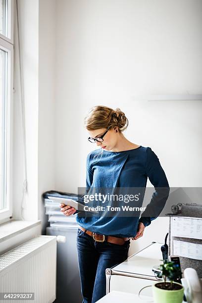portrait of a young casual start up businesswoman - red blouse fotografías e imágenes de stock