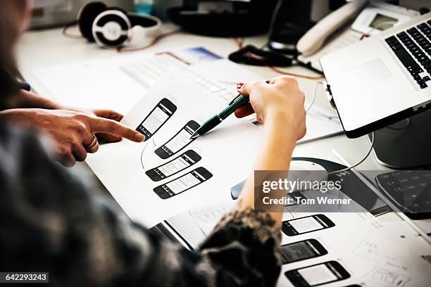 discussing interface design on a scheme - grafiker stock-fotos und bilder