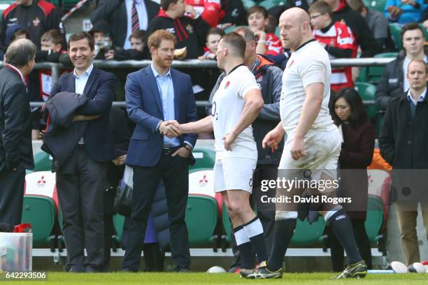 Prince Harry shakes hands with Dylan Hartley during an England open training session at Twickenham Stadium on February 17, 2017 in London, England.