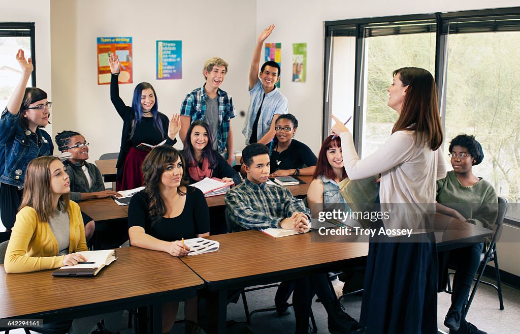 Female Instructor teaching high school class.