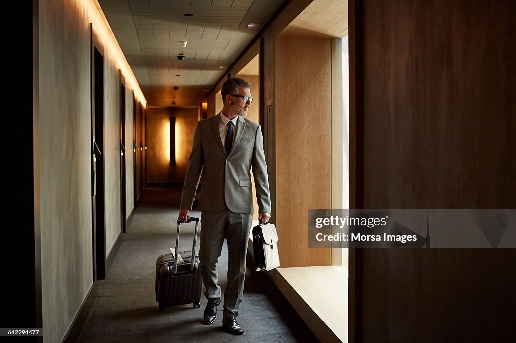 Businessman walking in corridor at hotel