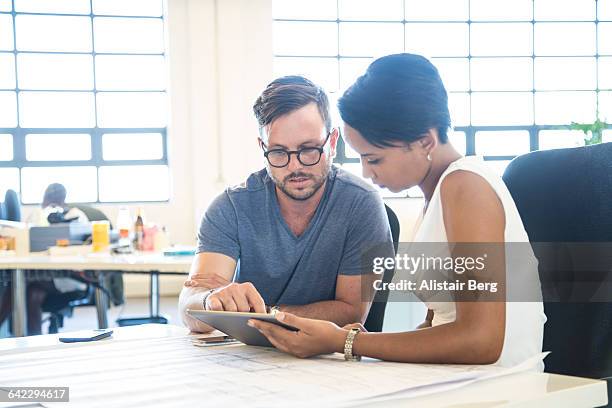 meeting in an open plan office - business incidental people cooperation stock pictures, royalty-free photos & images