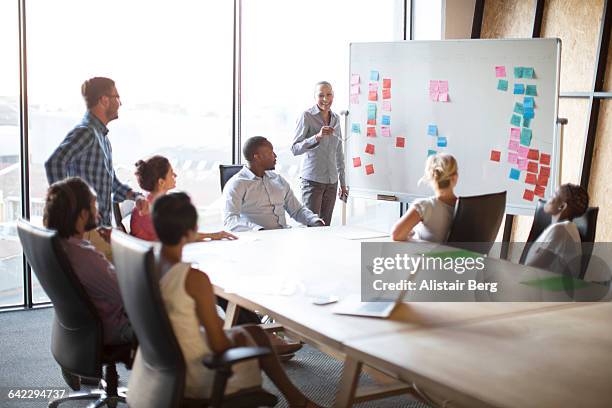 presentation in a conference room - business strategy whiteboard stock pictures, royalty-free photos & images