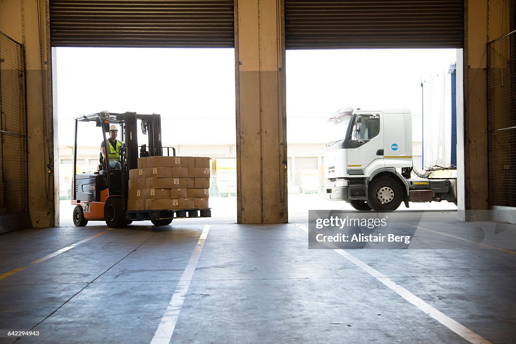 Forklift truck unloading a lorry