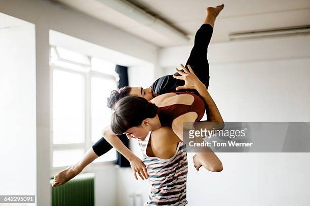 young dacning couple performing during rehearsal - dance team stock-fotos und bilder