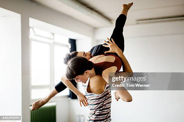 young dacning couple performing during rehearsal - sport performance stock pictures, royalty-free photos & images