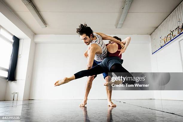 ballet couple perfomring in dance studio - performer bildbanksfoton och bilder