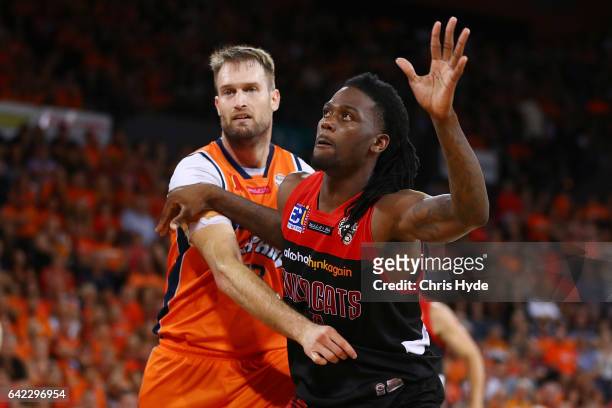 Mark worthington of the Taipans and Jameel McKay of the Wildcats compete for the ball during the NBL Semi Final Game 1 match between Cairns Taipans...