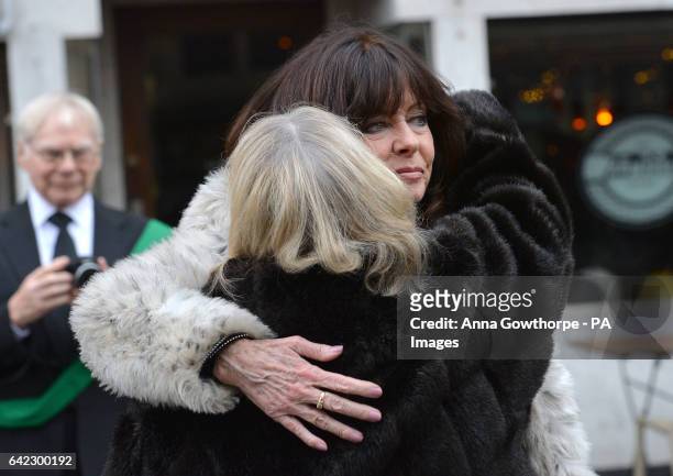 Actresses Vicki Michelle and Sue Hodge, hug each other as they arrive for the funeral of 'Allo 'Allo star Gordon Kaye at Huddersfield Parish Church.