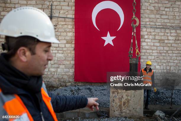 Construction workers begin digging at the site of the new controversial Taksim Mosque after a ground breaking ceremonyon February 17, 2017 in...