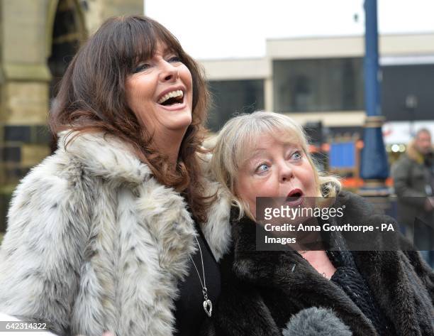 Actors Vicki Michelle and Sue Hodge stand together following the funeral service of, 'Allo 'Allo star Gorden Kaye, at Huddersfield Parish Church.