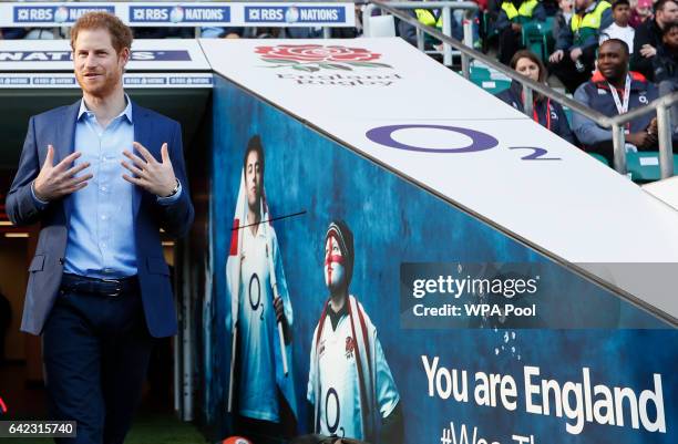 Britain's Prince Harry walks from the tunnel during a visit to an England Rugby Squad training session at Twickenham Stadium on February 17, 2017 in...