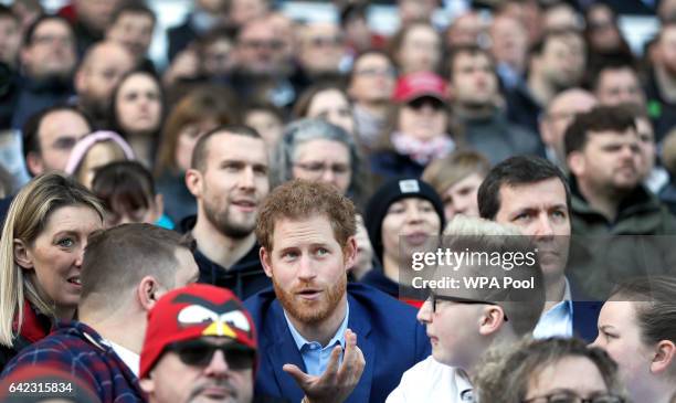 Britain's Prince Harry speaks with people from the RFU Try for Change programme during a visit to an England Rugby Squad training session at...