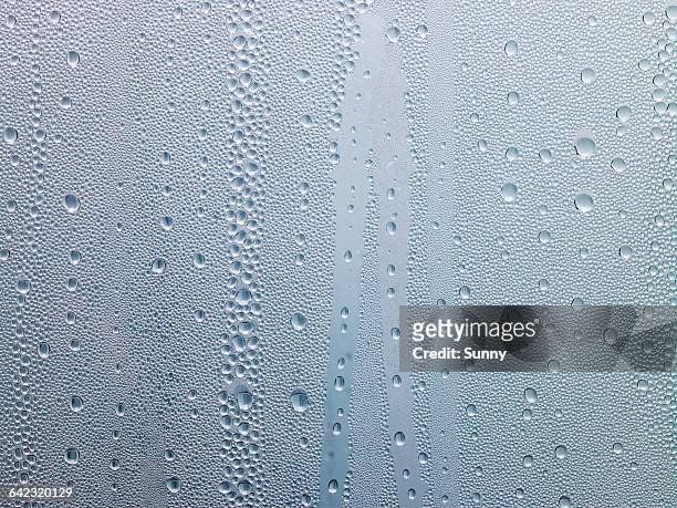 water drops, dew on window - morning dew stockfoto's en -beelden