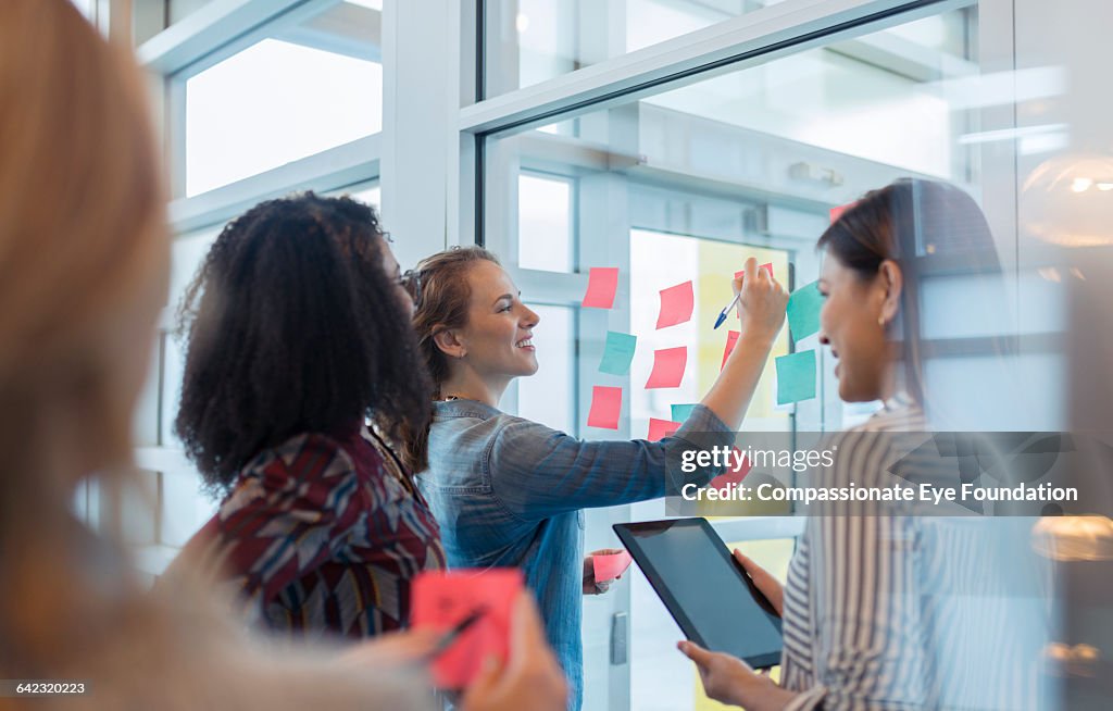 Businesswomen discussing project in office
