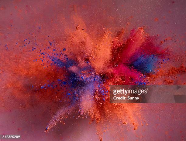 powder explosion - color image stock-fotos und bilder