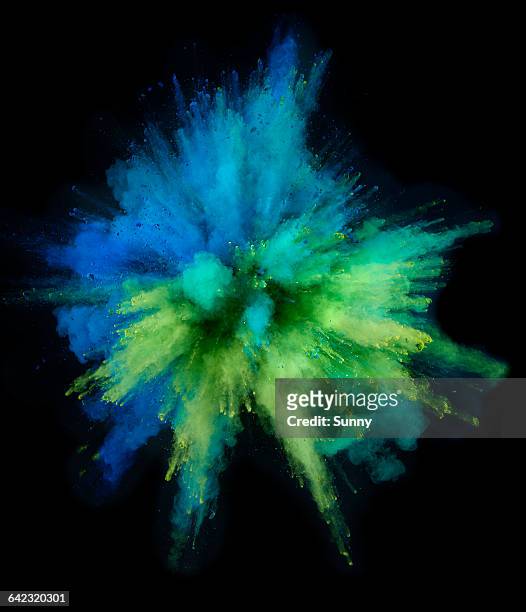 powder explosion - color image stock-fotos und bilder