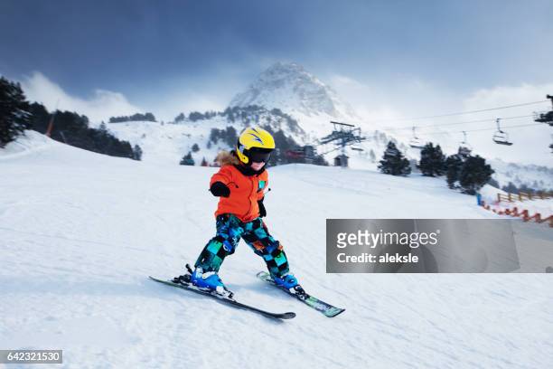little skier racing in snow - andorra stock pictures, royalty-free photos & images