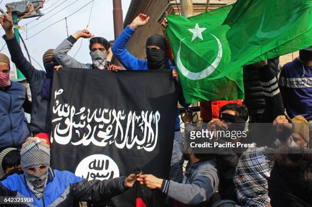 The masked youth carrying the Pakistani and ISIS flags. The protest took place after the Friday prayer against the civilian killings in South...