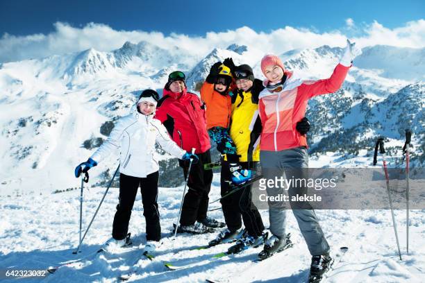 happy family enjoying winter vacations in mountains - andorra stock pictures, royalty-free photos & images