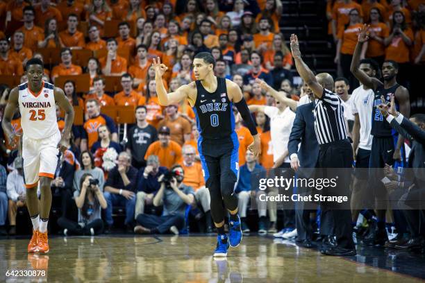 Jayson Tatum of the Duke Blue Devils and the Duke bench celebrate after a three by Tatum during Duke's game against the Virginia Cavaliers at John...