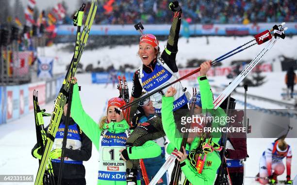 German's Laura Dahlmeier celebrates her voctory with teammates in the finish area after the women 4x6 km relay at the FIS Biathlon World...