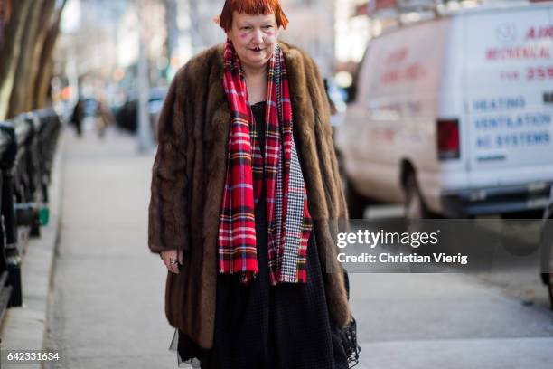 Guest wearing a fur coat outside Marc Jacobs on February 16, 2017 in New York City.