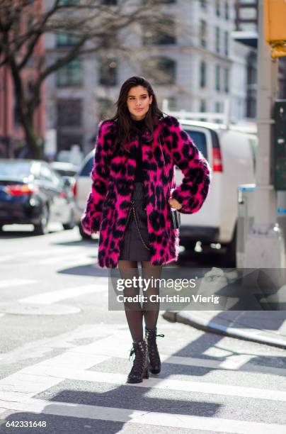 Model Sara Sampaio wearing a pink black leoprint coat outside Marc Jacobs on February 16, 2017 in New York City.