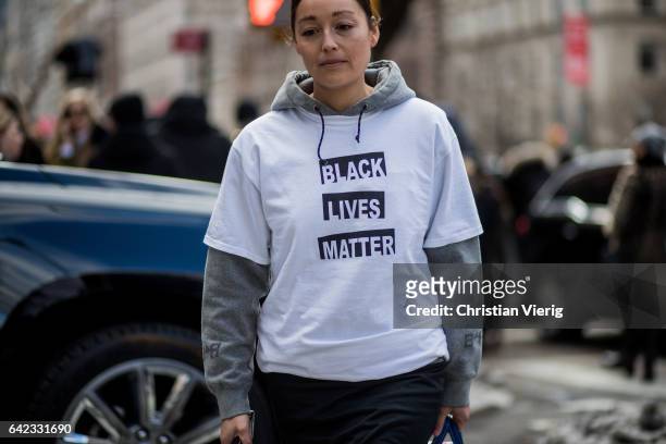 Rachael Wang wearing a white tshirt with the print Black Lives matter outside Marc Jacobs on February 16, 2017 in New York City.
