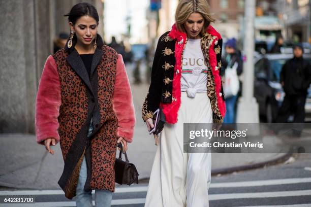 Guests wearing white wide leg pants, Gucci tshirt outside Marc Jacobs on February 16, 2017 in New York City.