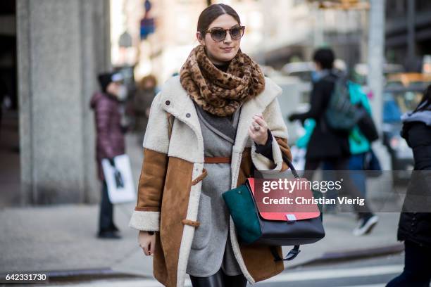 Guest wearing a Celine bag outside Marc Jacobs on February 16, 2017 in New York City.